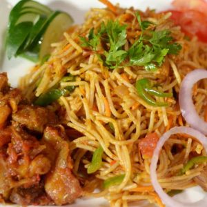 Vip spaghetti  jollof with shredded chicken and diced beef